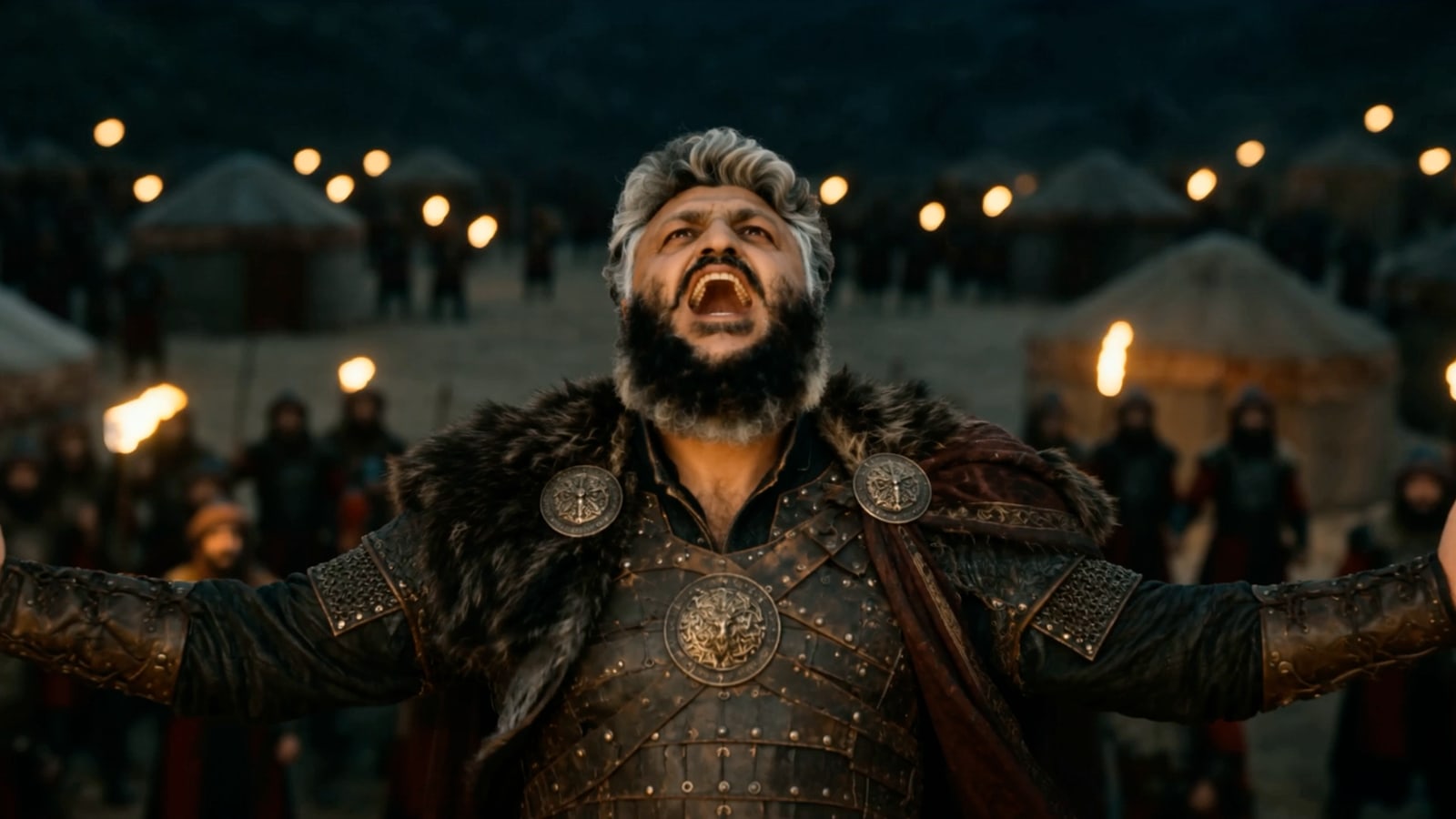 Sultan, arms raised before a torchlit camp, in A True Warrior